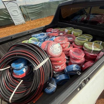 Coils of electrical cable loaded for delivery to site