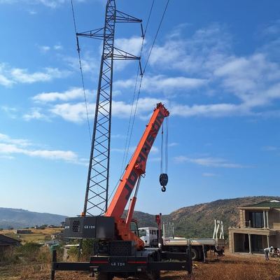 Johnson GR120 mobile crane positioned beside a power pylon